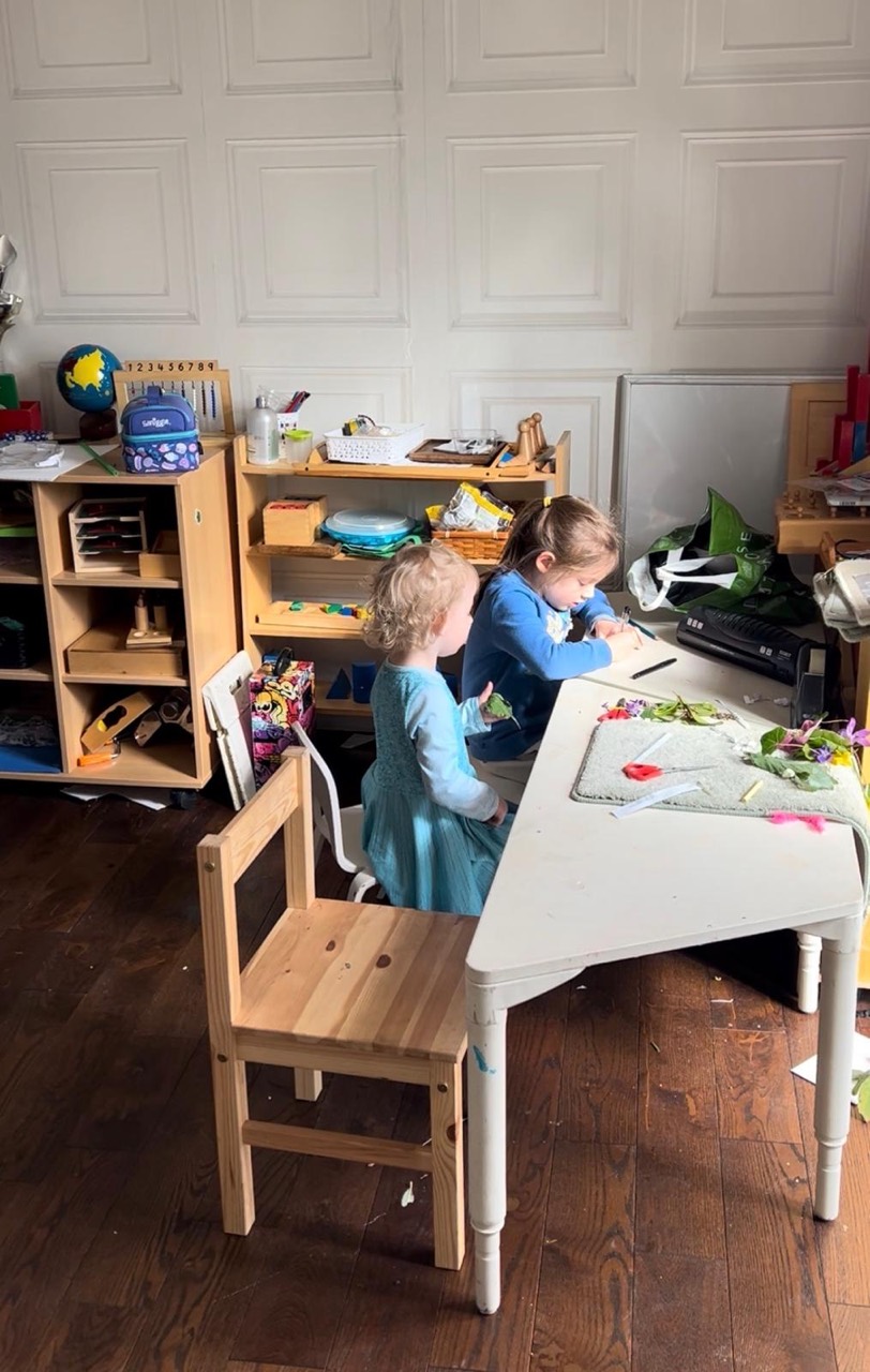 Children exploring hands-on activities at a Montessori table